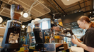 Barista using espresso machine and GbS grinder