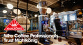 Why Coffee professionals trust Mahlkönig text on cafe and grinder image