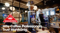 Why Coffee professionals trust Mahlkönig text on cafe and grinder image